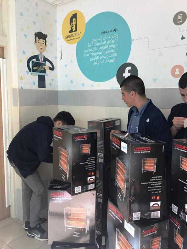 طلاب إسكندر يوزعون أجهزة التدفئة على المحتاجين