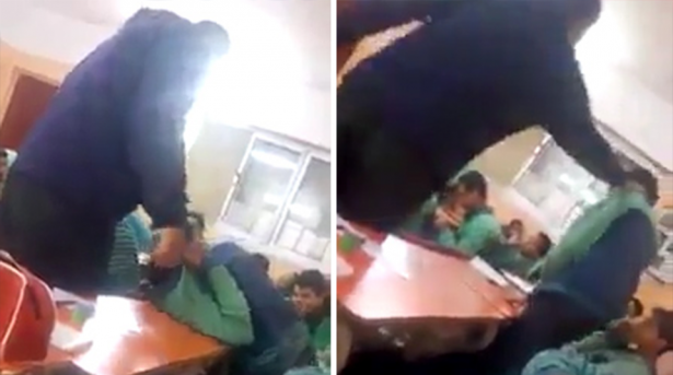 مدرس عربي يعتدي على طالب ويحاول كسر ذراعه وضربه بعنف في الفصل.. فيديو