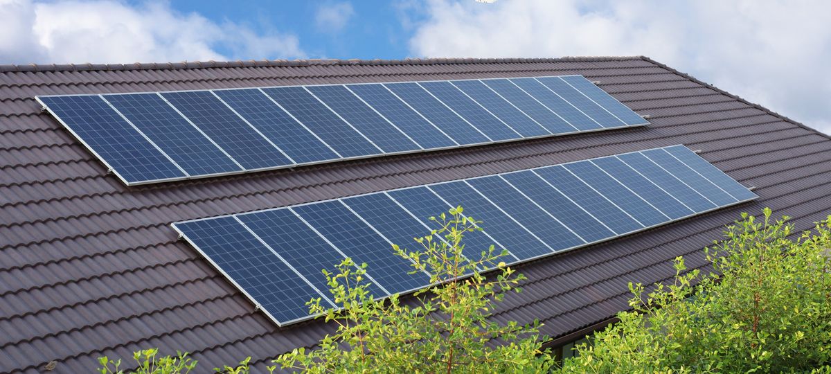 Solar,Panels,Installed,On,A,Dark,Tiled,Roof,Of,A | Shutterstock
