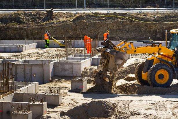 Heavy,Machinery,At,A,Construction,Site.,Growth,Of,The,Real | Shutterstock