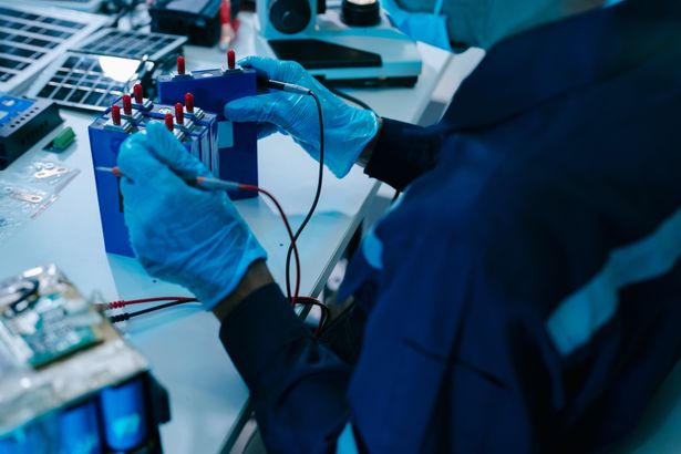 Engineer,Testing,A,Battery,Pack,With,A,Multimeter,In,A | Shutterstock