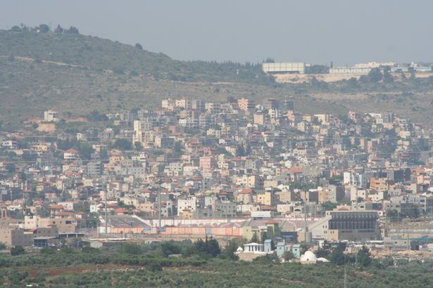 ملعب الدوحة وبلدة سخنين (تصوير: Oyoyoy / ويكيميديا كومنز، CC BY-SA 3.0)