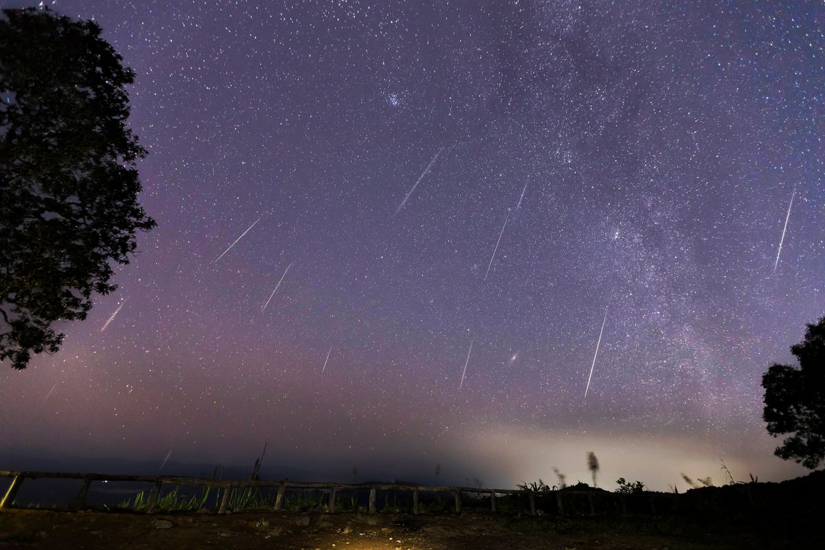 Geminid,Meteor,Shower,And,The,Milky,Way,Over,A,Mountain. | Shutterstock