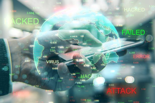 Close,Up,Of,Hands,Using,Hacked,Device,On,Blurry,Background | Shutterstock 