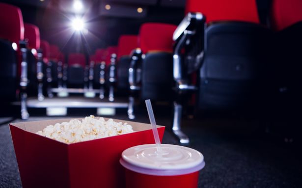 Empty,Rows,Of,Red,Seats,With,Pop,Corn,And,Drink | Shutterstock