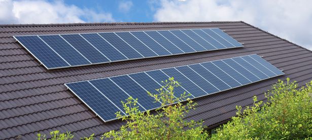 Solar,Panels,Installed,On,A,Dark,Tiled,Roof,Of,A | Shutterstock